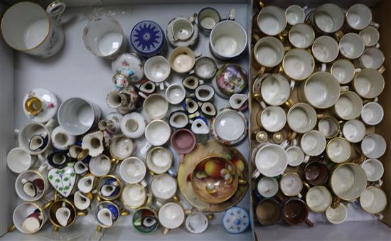 A large collection of miniature porcelain mugs and other ceramics including Royal Worcester, Royal Crown Derby, Royal Doulton etc.